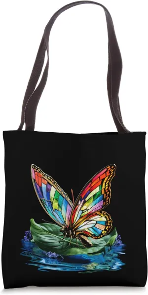 Radiant Rainbow Butterfly Emerges from Tranquil Waters Tote Bag